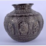 A 19TH CENTURY MIDDLE EASTERN INDIAN PERSIAN SILVER OVERLAID VASE decorated with Buddhistic figures.