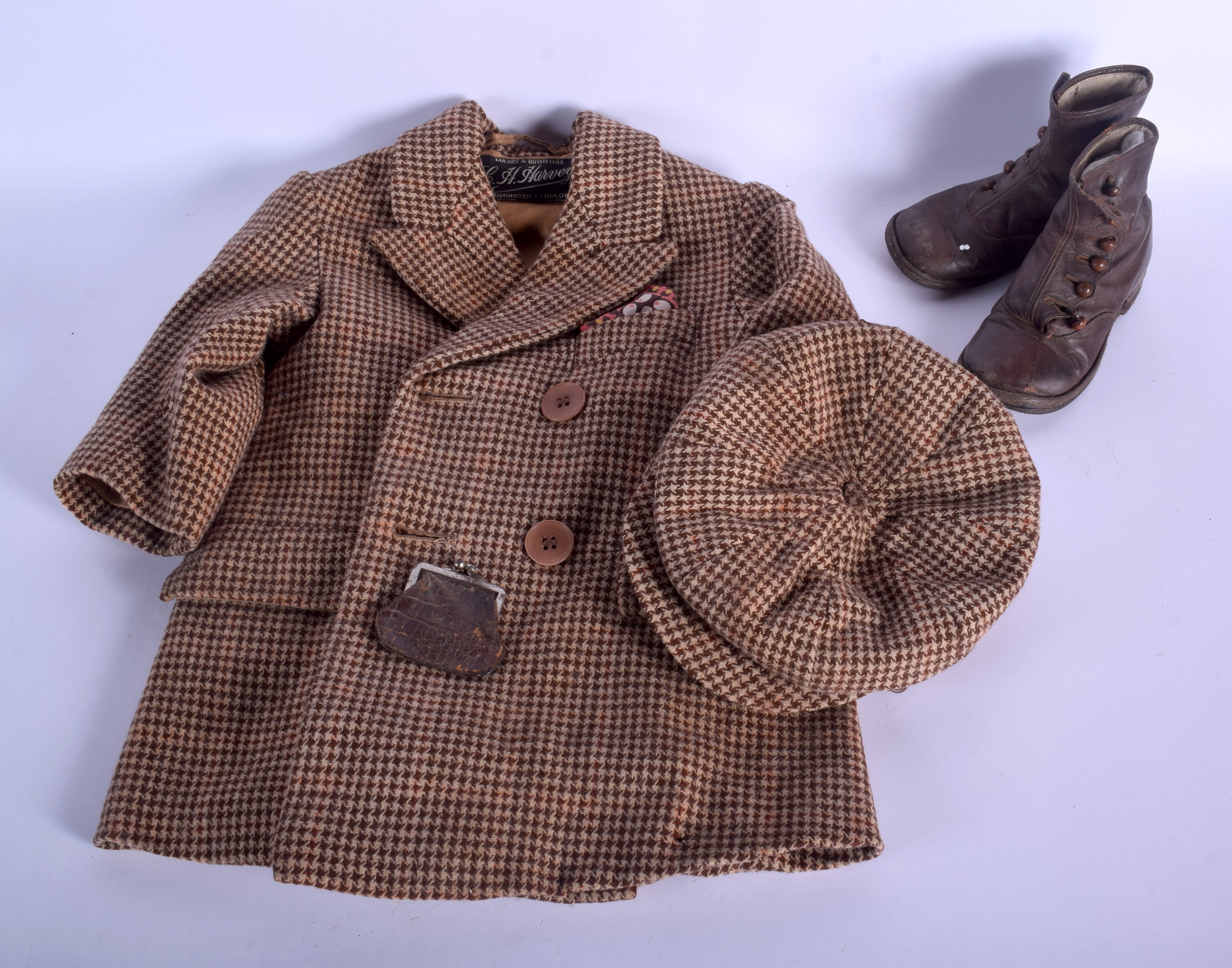 AN EDWARDIAN CHILDS TWEED JACKET with shoes, hat and purse. (qty)