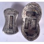 TWO CHINESE WHITE METAL INGOTS, varying form, weight 582 grams. Largest 8.8 cm wide.