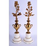 A PAIR OF 19TH CENTURY FRENCH BRONZE FLOWER VASES upon marble bases. 44 cm high.