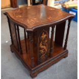 AN EDWARDIAN REVOLVING BOOKSHELF, inlaid with satinwood foliage. 33 cm x 33 cm.