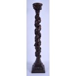 A LARGE 19TH CENTURY CONTINENTAL CARVED WOOD CANDLESTICK probably German. 60 cm high.