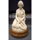 A 19TH CENTURY EUROPEAN CARVED MARBLE FIGURE OF A FEMALE modelled with hands clasped holding a lyre.