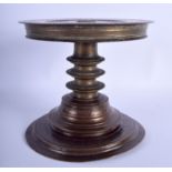 AN 18TH/19TH CENTURY MIDDLE EASTERN PERSIAN BRONZE PEDESTAL STAND engraved with foliage. 19 cm x 19