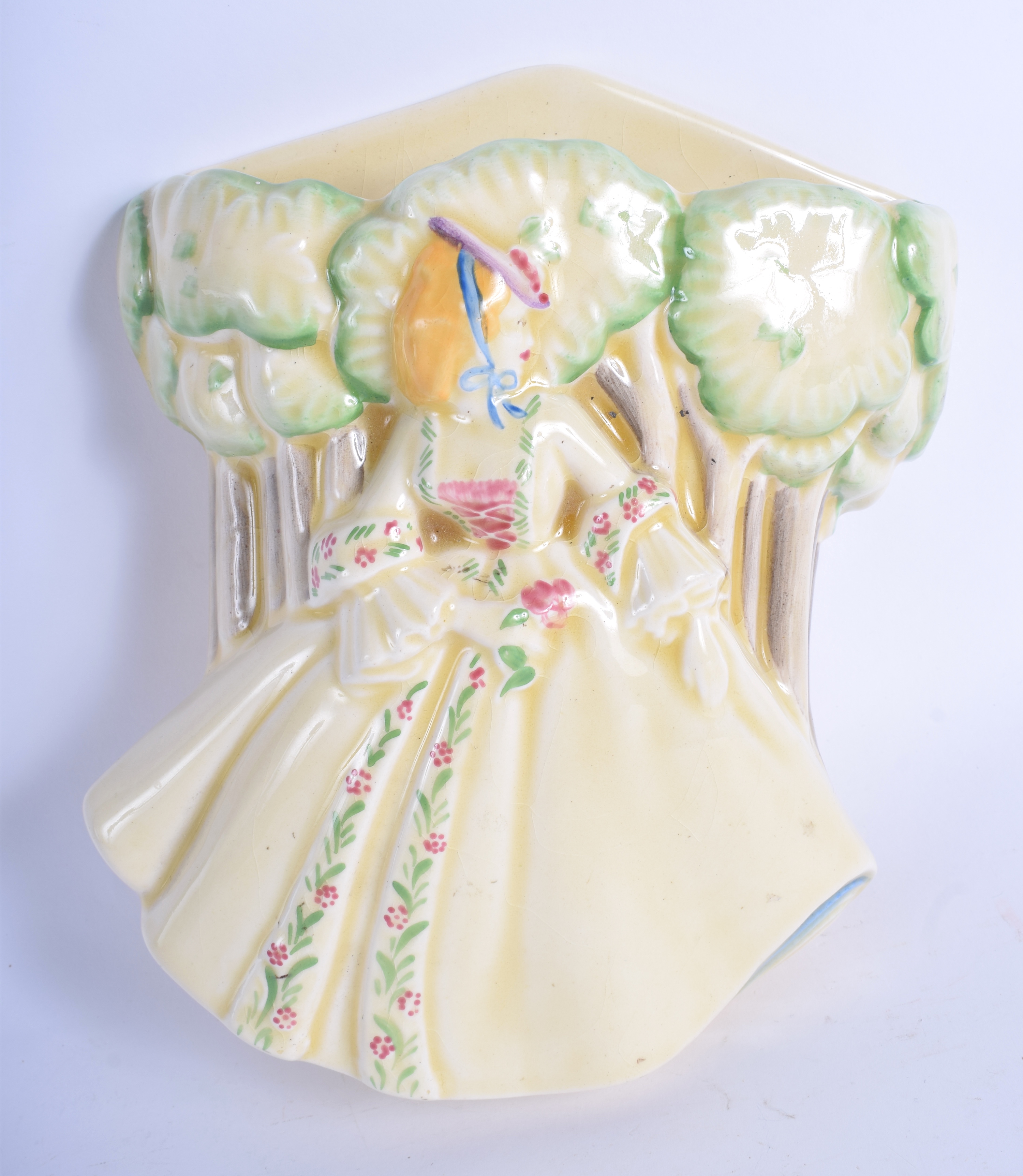 AN UNUSUAL ART DECO CRINOLINE LADY WALL POCKET decorated with a female. 17 cm x 17 cm.