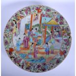 A LARGE 19TH CENTURY CHINESE CANTON FAMILLE ROSE CHARGER Qing, painted with figures. 37 cm diameter.