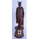 AN EARLY 20TH CENTURY BAVARIAN BLACK FOREST FIGURE OF A VIKING modelled upon an octagonal base. 30 c