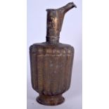 AN ISLAMIC BRASS EWER, decorated with symbols. 35 cm high.