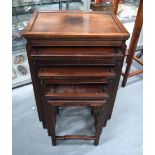 AN EARLY 20TH CENTURY CHINESE HARDWOOD NEST OF TABLES of plain form. 67 cm x 51 cm.