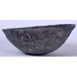 AN EARLY ISLAMIC METAL BOWL, of plain form. 16 cm wide.