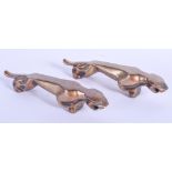 A PAIR OF ART DECO STYLISED BRONZE PANTHERS. 11 cm long.