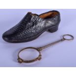 AN ANTIQUE LEATHER SHOE together with a pair of lorgnettes. (2)