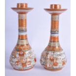 A PAIR OF 19TH CENTURY JAPANESE MEIJI PERIOD KUTANI CANDLE STICK VASES. 18 cm high.