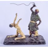 A COLD PAINTED BRONZE FIGURE OF AN ARABIC MALE modelled whipping a servant. 18 cm x 16 cm.