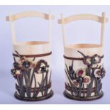 A RARE PAIR OF 19TH CENTURY SILVER ENAMEL AND IVORY BASKETS bound in bronze and overlaid in flowers