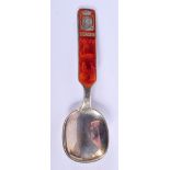 AN UNUSUAL VINTAGE SILVER AND ENAMEL SPOON. 12.5 cm long.