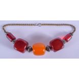 A 1950S MIDDLE EASTERN AMBER TYPE NECKLACE. 20 cm long.