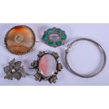 FOUR SILVER BROOCHES and a silver bangles. (5)