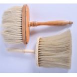 A VICTORIAN IVORY BRUSH and another. 16.5 cm long. (2)