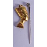 AN ART DECO TIE PIN together with a yellow metal pendant. 9.4 grams. (2)