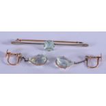 AN ANTIQUE EDWARDIAN AQUAMARINE BROOCH and matching earrings. (3)