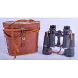 A PAIR OF LEATHER CASED BINOCULARS.
