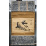 A JAPANESE WATERCOLOUR SCROLL PAINTING, depicting a seated cow, signed. 28.5 cm x 41 cm.