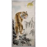 A CHINESE WATERCOLOUR SCROLL PAINTING, seal mark Gao Ru Song,a tiger in a landscape. 127 cm x 61 cm