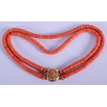 AN 18CT GOLD AND CORAL NECKLACE. Each strand 34 cm long. Each bead 0.4 cm x 0.4cm. 63 grams.