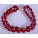 A CHERRY AMBER TYPE NECKLACE. 21 grams. 42 cm long.