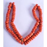 A CARVED RED CORAL NECKLACE. 64 cm long.