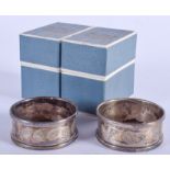 A PAIR OF ANTIQUE SILVER NAPKIN RINGS.