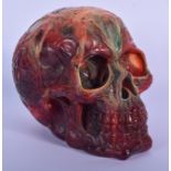 A LARGE GROTESQUE AMBER TYPE SKULLL. 18 cm x 15 cm.