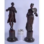 A LARGE PAIR OF 19TH CENTURY GERMAN BRONZE FIGURES OF A MALE AND FEMALE upon marble bases. 40 cm hi