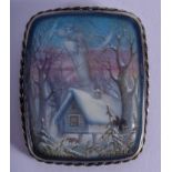 AN ANTIQUE SILVER AND ENAMEL BROOCH painted with a winter landscape. 4.5 cm x 6.5 cm.