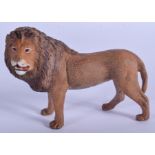 A COLD PAINTED BRONZE LION. 9 cm x 7.5 cm.