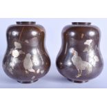 A LOVELY PAIR OF 19TH CENTURY JAPANESE SILVER INLAID BRONZE VASES of gourd form, decorated with fow