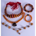 THREE AMBER STYLE NECKLACES and two bangles. (5)