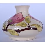 A MOORCROFT VASE Hibiscus pattern. 12.5 cm high.