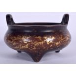 A CHINESE BRONZE GOLD SPLASH CENSER BEARING XUANDE MARKS, formed with twin loop handles. 13 cm wide