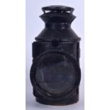 AN ANTIQUE LMS RAILWAY LANTERN, painted black. 24 cm high.