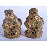 A PAIR OF 17TH/18TH CENTURY CHINESE LACQUERED STONE BUDDHISTIC LIONS Ming/Qing, decorated with gree