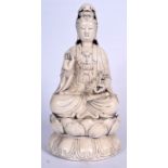 A LARGE CHINESE BLANC DE CHINESE PORCELAIN FIGURINE F GUANYIN, formed seated upon a lotus pod holdi