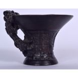 A CHINESE CARVED BAMBOO LIBATION CUP, formed with chilong handle and bearing Yongzheng marks to bas