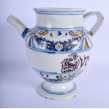 AN 18TH/19TH CENTURY ITALIAN FRENCH FAIENCE TIN GLAZED EWER painted with foliage. 22 cm high.
