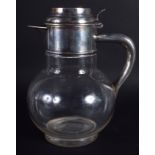 AN EDWARDIAN SILVER AND CRYSTAL GLASS DECANTER. 20 cm high.