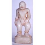 AN EARLY 20TH CENTURY HIMALAYAN MARBLE BUDDHA, carved standing. 23 cm high.