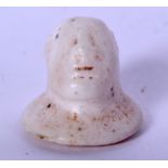 A BACTRIAN CARVED STONE IDOL. 2.5 cm x 2.5 cm.