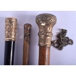 THREE VICTORIAN GOLD MOUNTED WALKING CANES. Largest 90 cm long. (3)