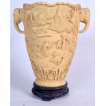 A LARGE CHINESE FAUX IVORY TWIN HANDLED VASE, decorated with figures in landscapes. 30 cm high.